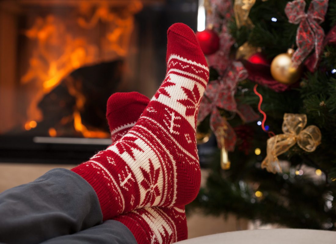 Relaxation after christmas in cozy interior with fireplace